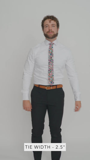 Abyss 2.5" Wide Skinny Tie worn with a white shirt, brown belt and black suit pants.