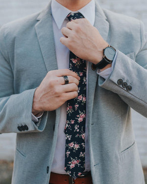 Bittersweet tie worn with a whit shirt and gray suit jacket.