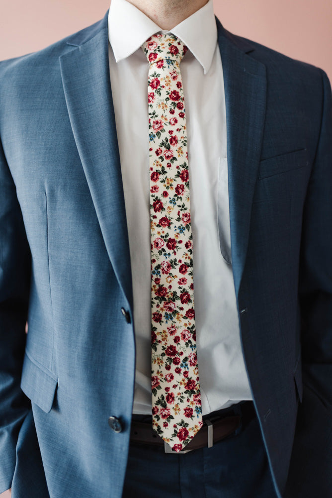 Fiore tie worn with a white shirt and blue suit. 