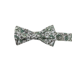 Hidden Garden Pre-Tied Bow Tie. White background with sage green flowers and leaves with black vines.