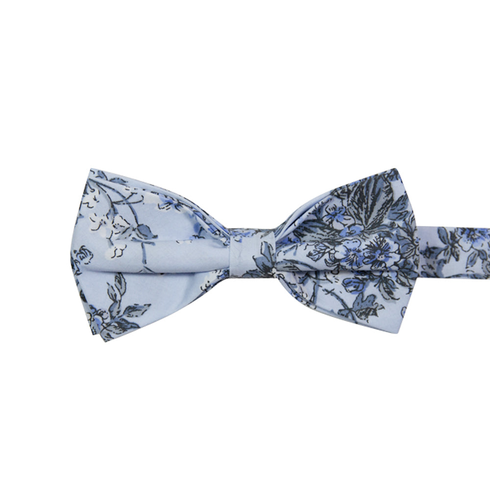 Indie Skye Pre-Tied Bow Tie. Dusty blue background with white, blue, black and gray floral leaf pattern.