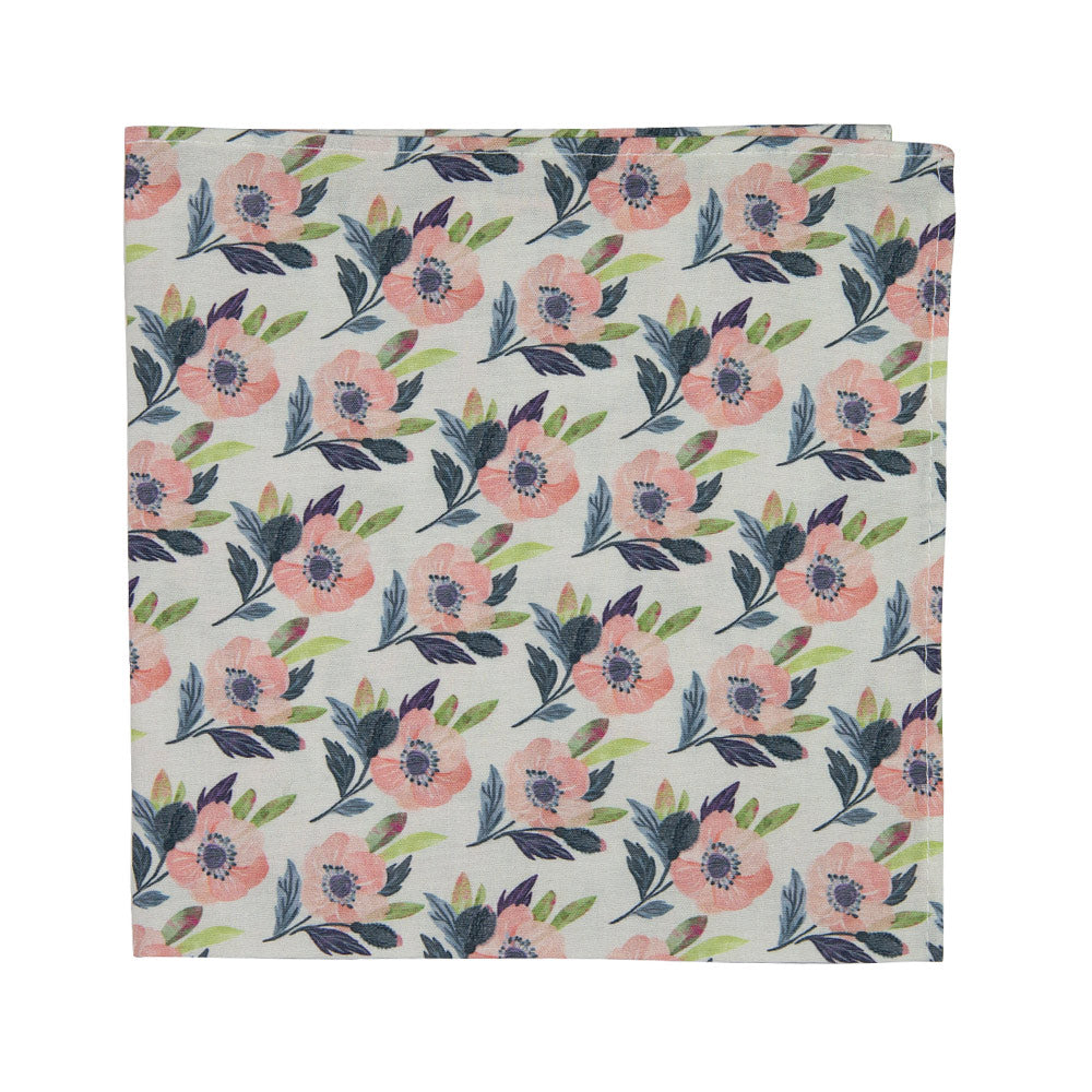 Magnolia Pocket Square. Off white background with pink flowers and blue and green leaves. 