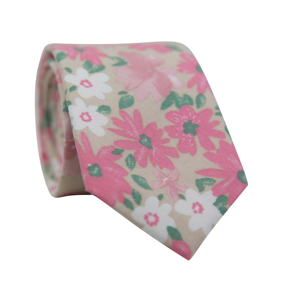 Pink Spice Skinny Tie. Tan champagne background with medium sized blush pink and mauve pink flowers, small white flowers, and small green leaves throughout.