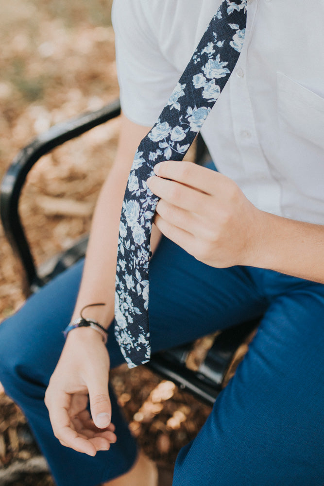 Star Gaze tie worn with a white short sleeve shirt and royal blue pants.