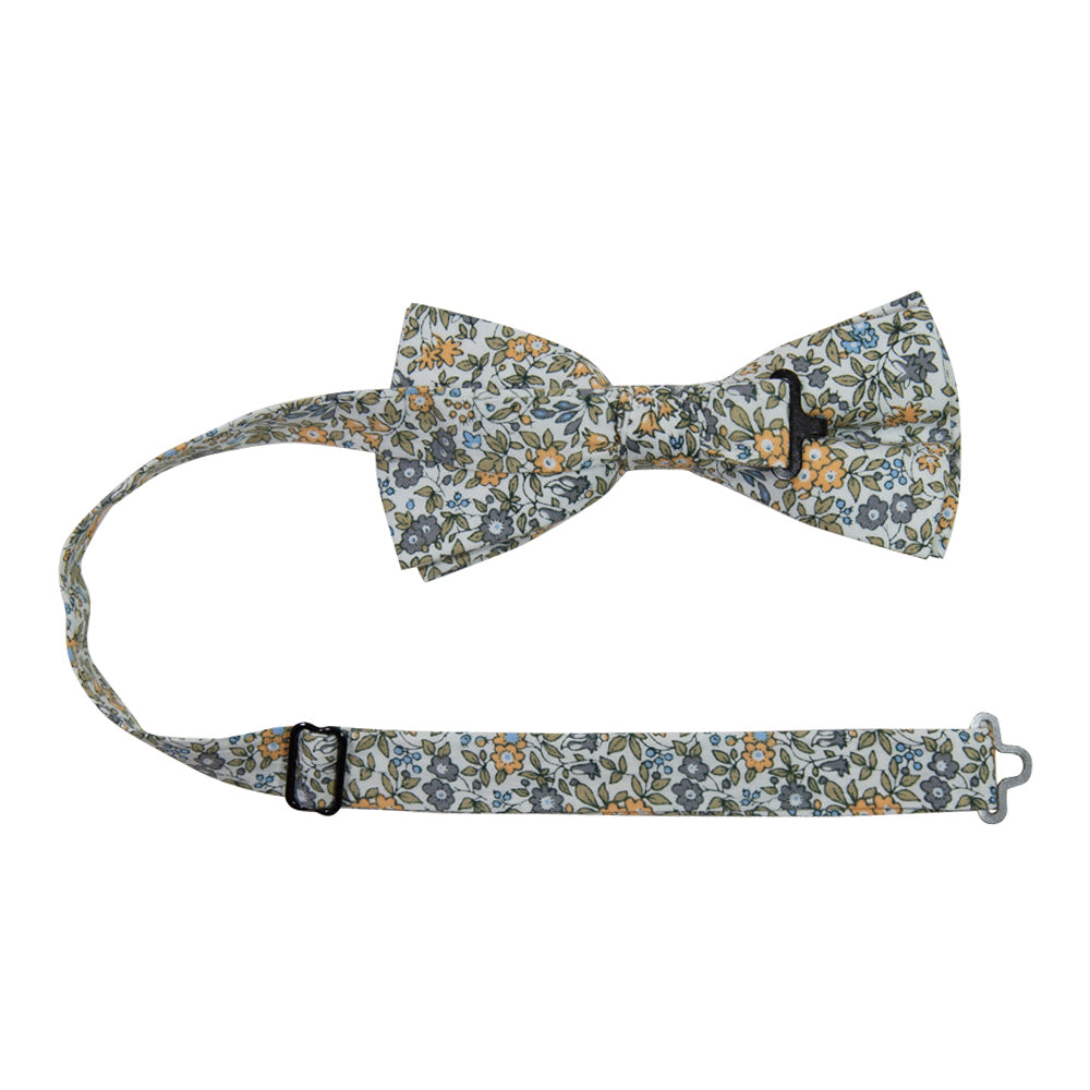 Sunny Meadow Floral Pre-Tied Bow Tie with adjustable neck strap. White background with yellow and gray flowers and tan leaves throughout.