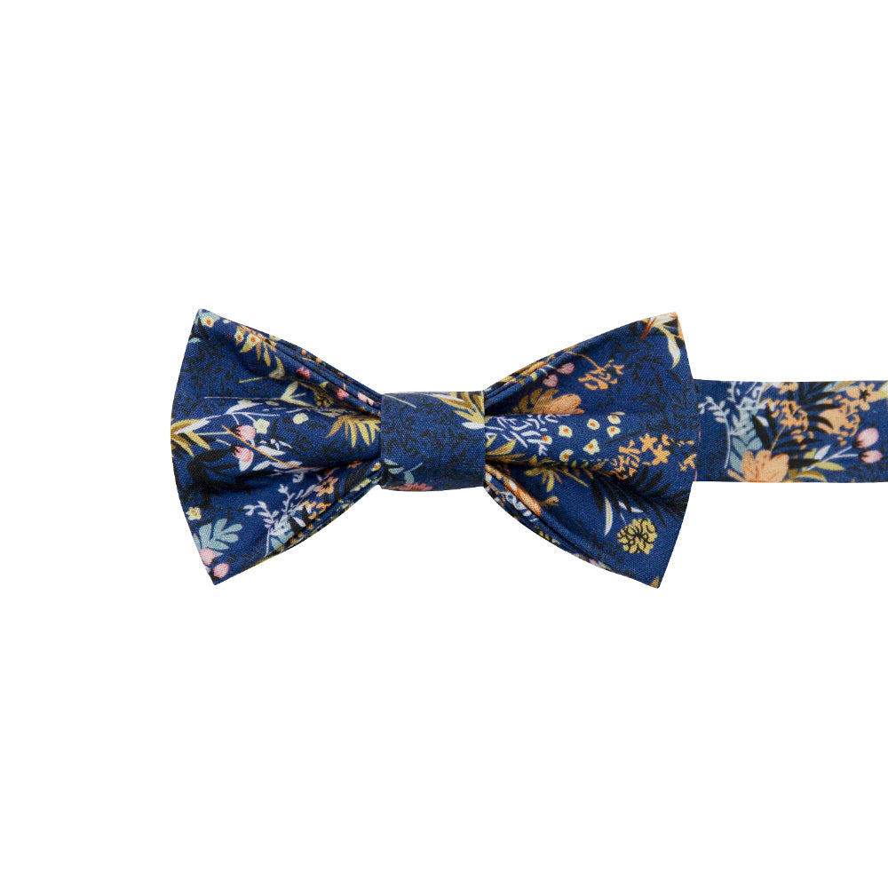 Tiger Lily Pre-Tied Bow Tie. Dark navy blue background with peach flowers and dusty blue, yellow, green and black leaves.
