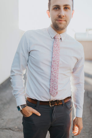 Ventura tie worn with a light gray shirt and blue/gray pants.