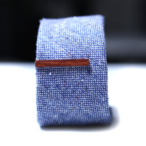 Red Brown Wood Tie Bar on a textured blue tie. 