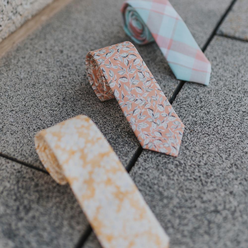 DAZI Various Ties Laid Out Along The Floor Rolled Up