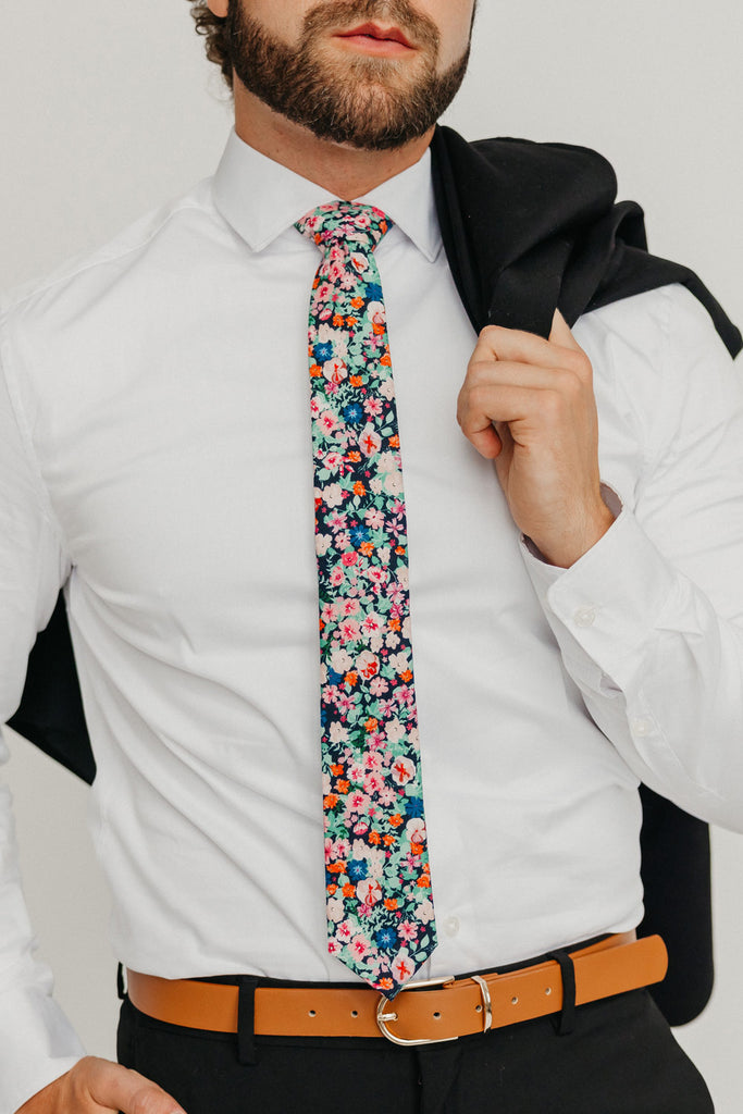 Abyss 2.5" Wide Skinny Tie worn with a white shirt, brown belt and black suit pants.