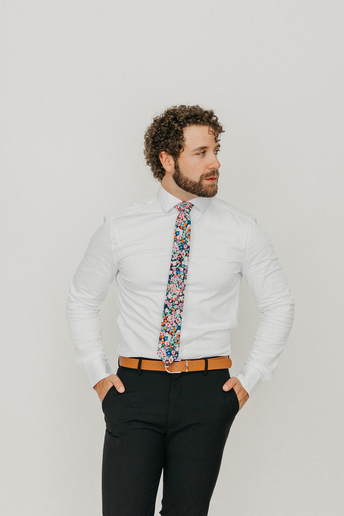 Abyss 2.5" Wide Skinny Tie worn with a white shirt, brown belt and black suit pants.