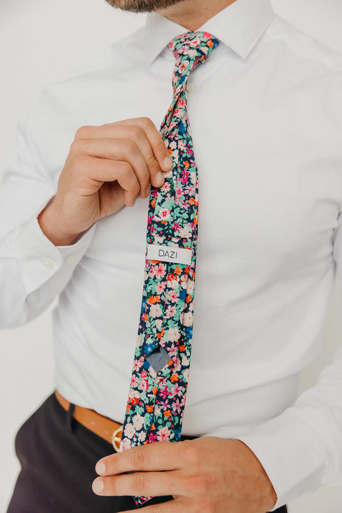 Abyss 2.5" Wide Skinny Tie worn with a white shirt, brown belt and black suit pants.
