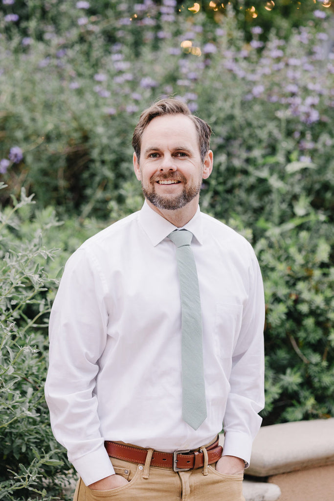 Agave tie worn with a white shirt and tan pants.