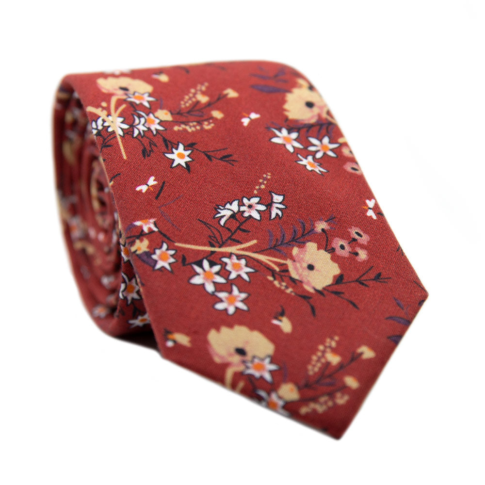 Autumn Skinny Tie. Red background with tan, peach and white flowers with black stems and leaves.