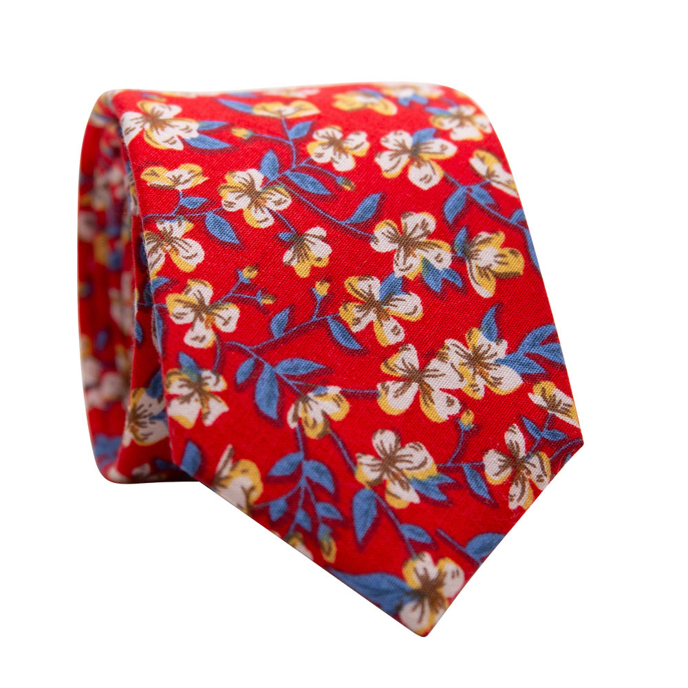 Blaze Skinny Tie. Red background with white and yellow gold flowers and dusty light blue leaves. 