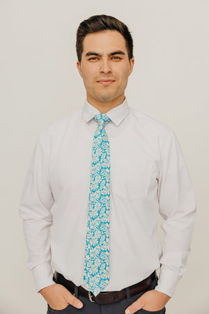 Blue Daisy 3" Wide Standard Tie worn with a white shirt, black belt and black suit pants.
