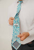 Blue Daisy 3" Wide Standard Tie worn with a white shirt, black belt and black suit pants.
