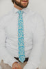 Blue Daisy 2.5" Wide Skinny Tie worn with a white shirt, brown belt and tan suit pants.