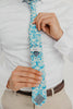 Blue Daisy 2.5" Wide Skinny Tie worn with a white shirt, brown belt and tan suit pants.
