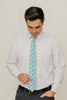 Blue Daisy 3" Wide Standard Tie worn with a white shirt, black belt and black suit pants.