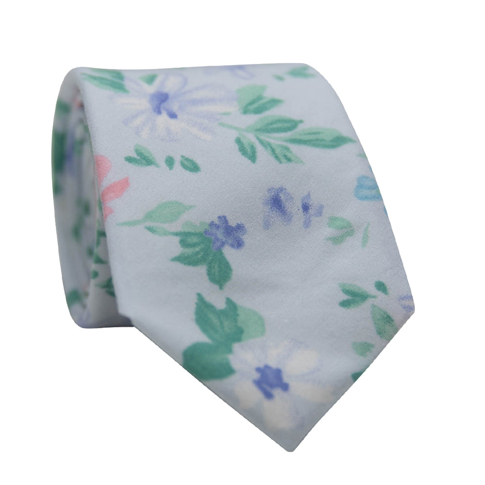 Blue Freesia Necktie. Blue background with small pink and blue flowers with green leaves.