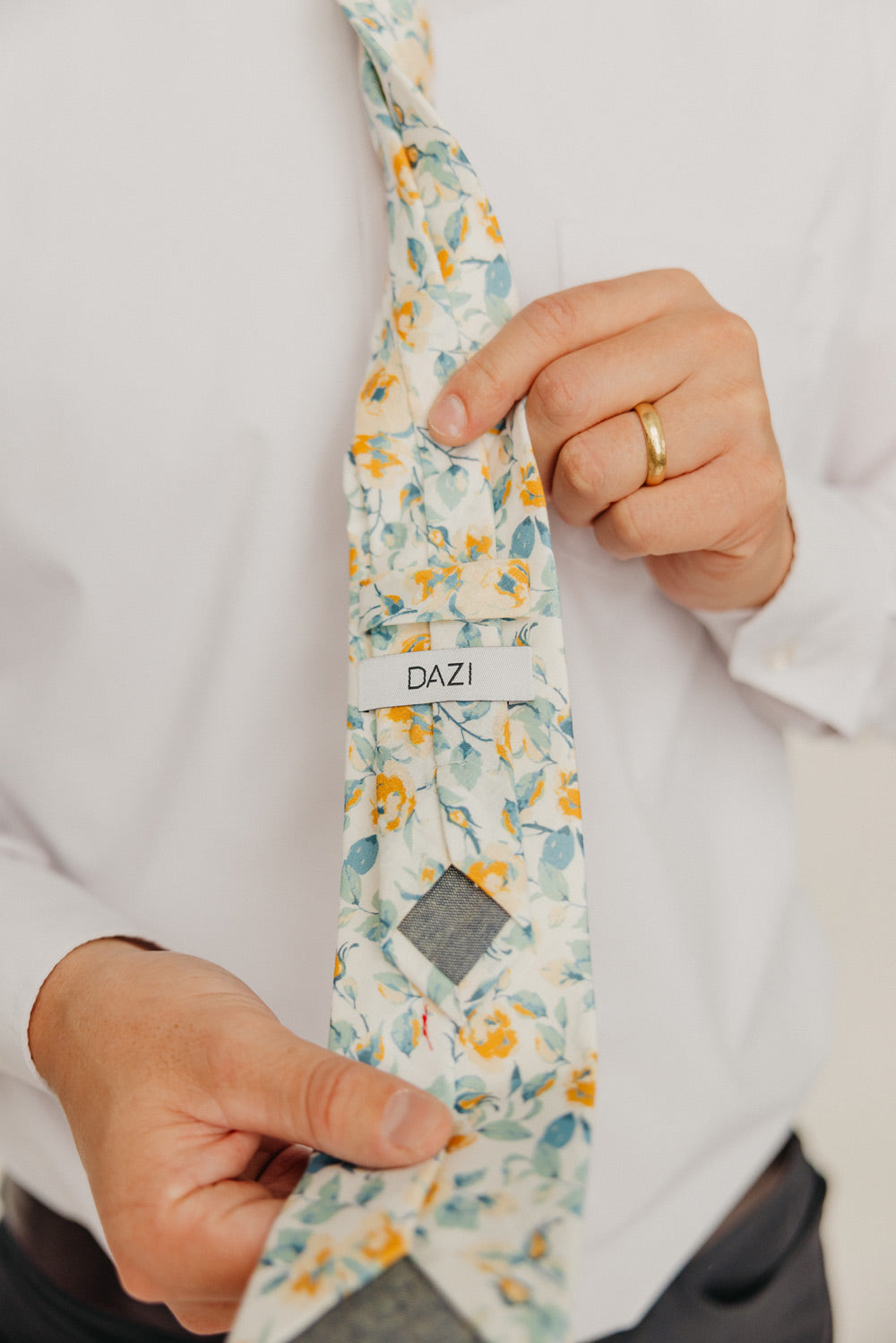 Butterscotch 3" Wide Standard Tie worn with a white shirt, black belt and black suit pants.