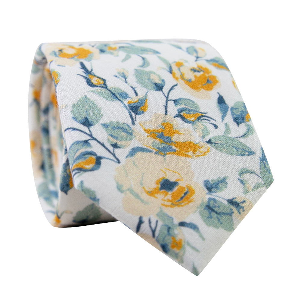 Butterscotch Skinny Tie. White background with yellow gold flowers and mint sage green leaves.