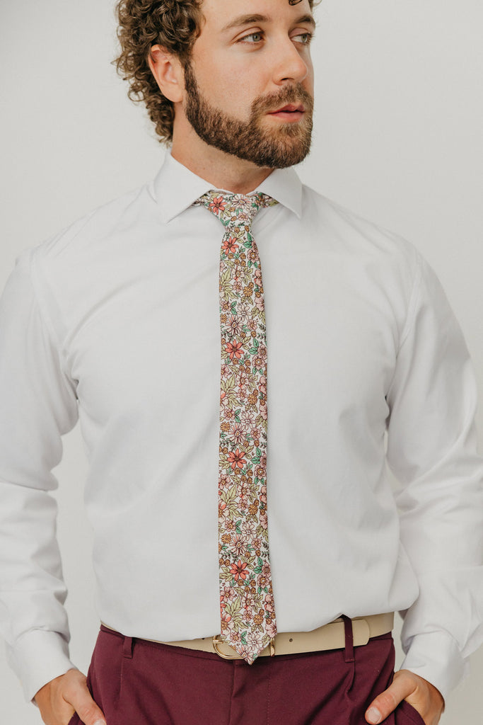 Carnation 2.5" Wide Skinny Tie worn with a white shirt, tan belt and maroon suit pants.