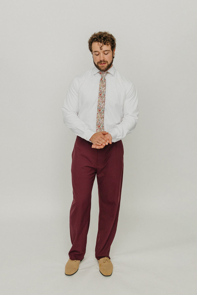 Carnation 2.5" Wide Skinny Tie worn with a white shirt, tan belt and maroon suit pants.