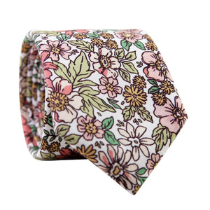 Carnation Skinny Tie. White background with a mix of pink and yellow flowers and green leaves.