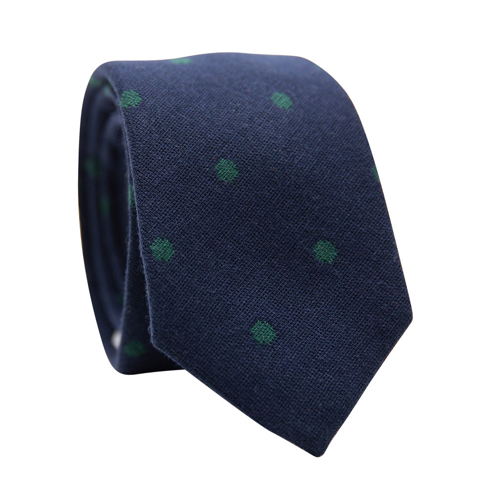 Cedar Spots Skinny Tie. Navy blue background with sage green spots. 