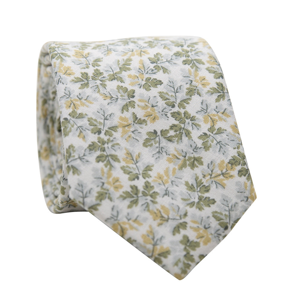 Fern Skinny Tie. White background with small sage green, yellow gold and very light blue/gray leaves.