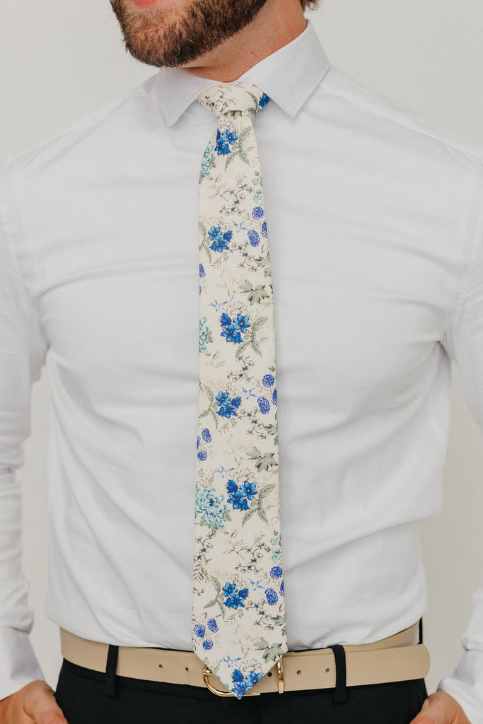 French Love 3" Wide Standard Tie worn with a white shirt, tan belt and black suit pants.