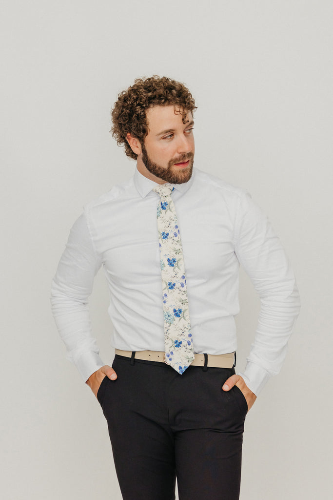 French Love 3" Wide Standard Tie worn with a white shirt, tan belt and black suit pants.