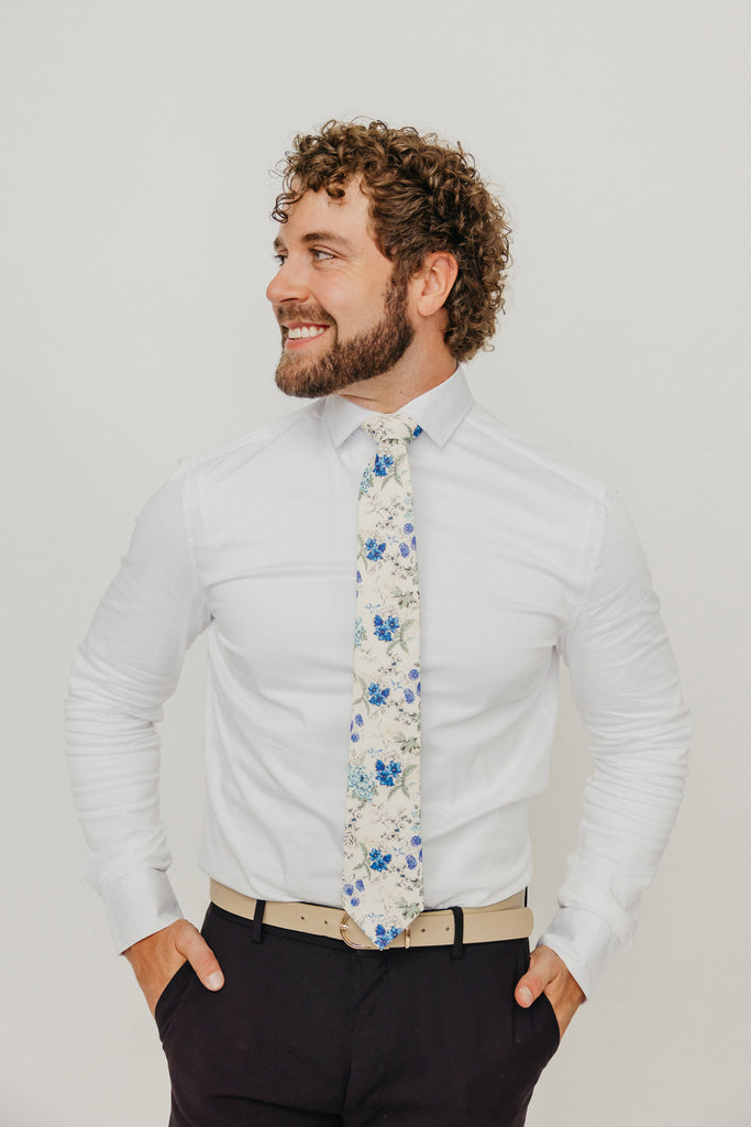 French Love 3" Wide Standard Tie worn with a white shirt, tan belt and black suit pants.