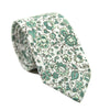 Hidden Garden Skinny Tie. White background with sage green flowers and leaves with black vines.
