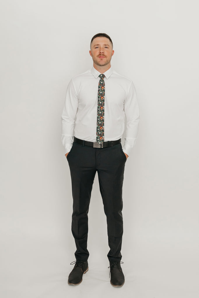 DAZI Holly Skinny Tie worn with a white shirt, black belt and black suit pants.