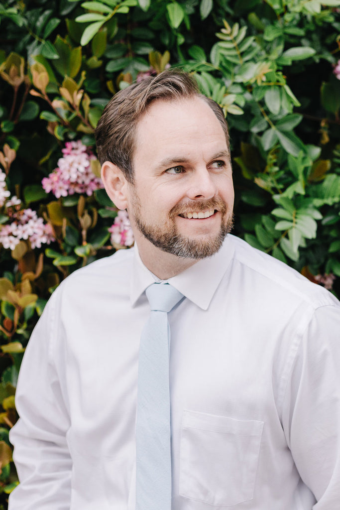 Ice Blue tie worn with a white shirt.