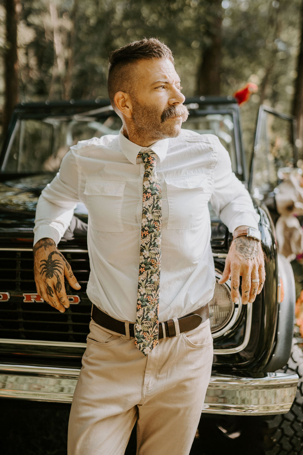 Jumanji Tie worn with a white shirt and tan pants.
