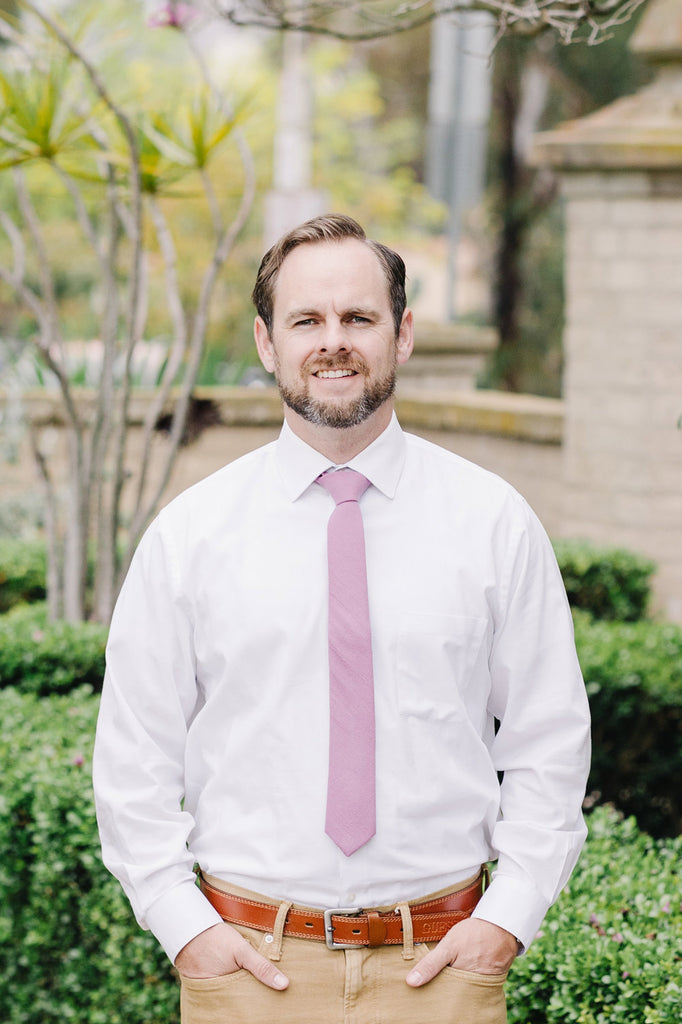 Lilas Tie worn with a white shirt and tan pants.
