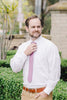 Lilas Tie worn with a white shirt and tan pants.
