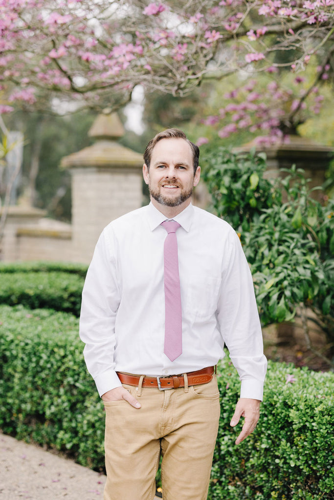 Lilas Tie worn with a white shirt and tan pants.