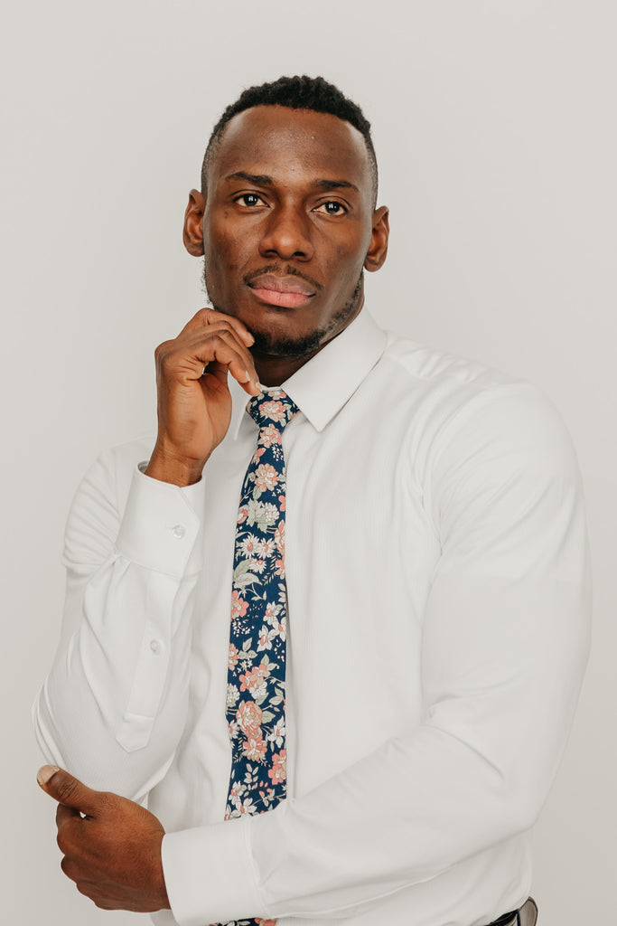 Lotus tie worn with a white shirt.