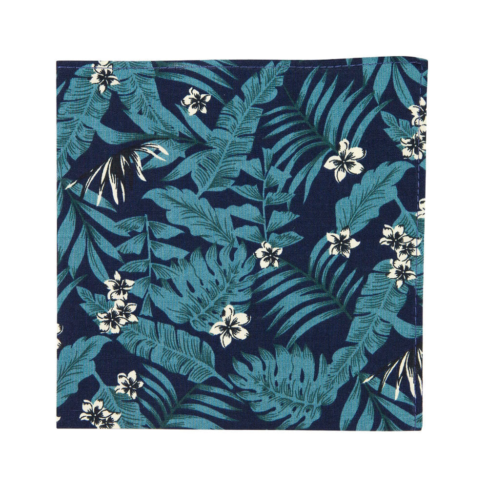 Lush Pocket Square. Navy blue background with big green leaves and small cream and black flowers throughout. 
