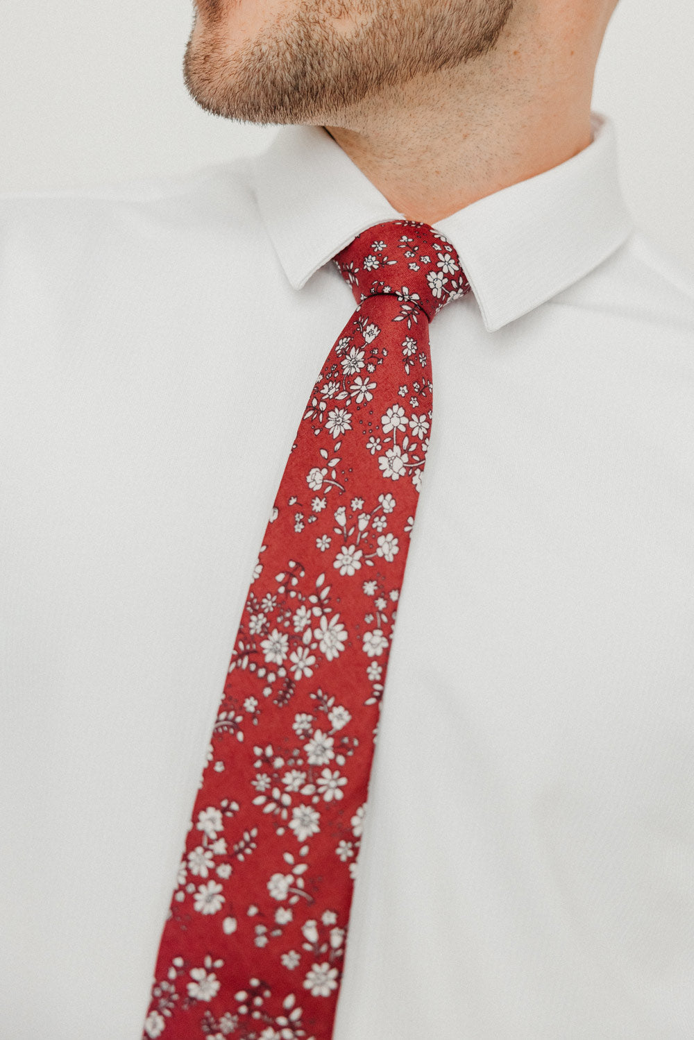 Mahogany tie worn with a white shirt.