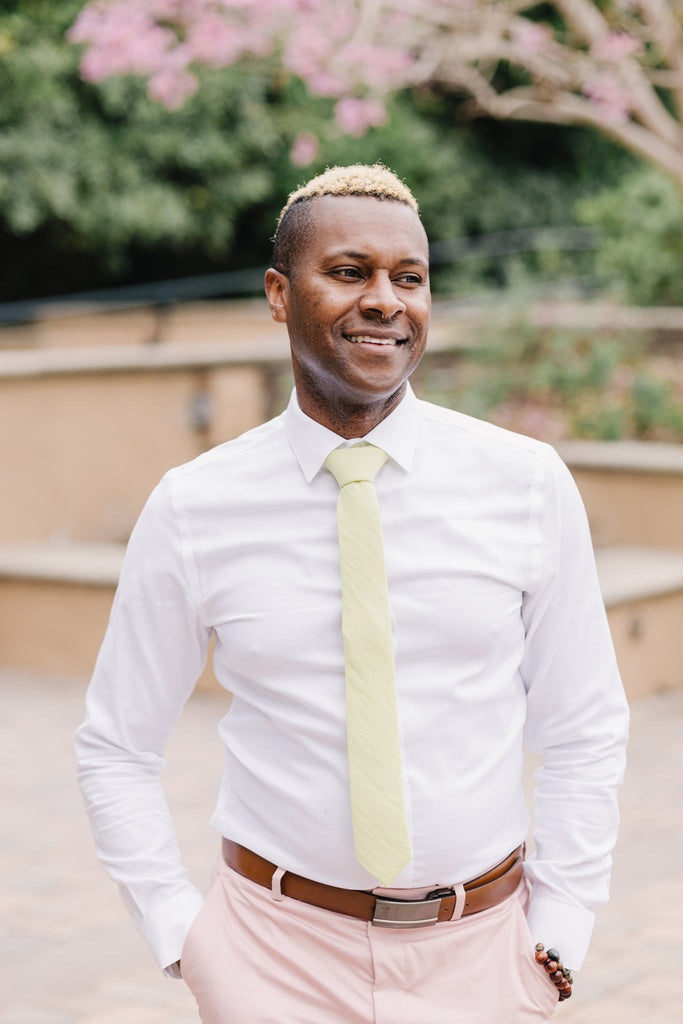 Pale Lime tie worn with a white shirt and light pink suit pants.