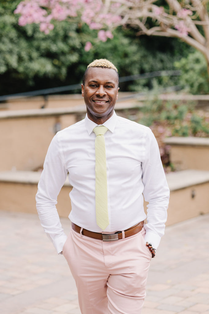 Pale Lime tie worn with a white shirt and light pink suit pants.