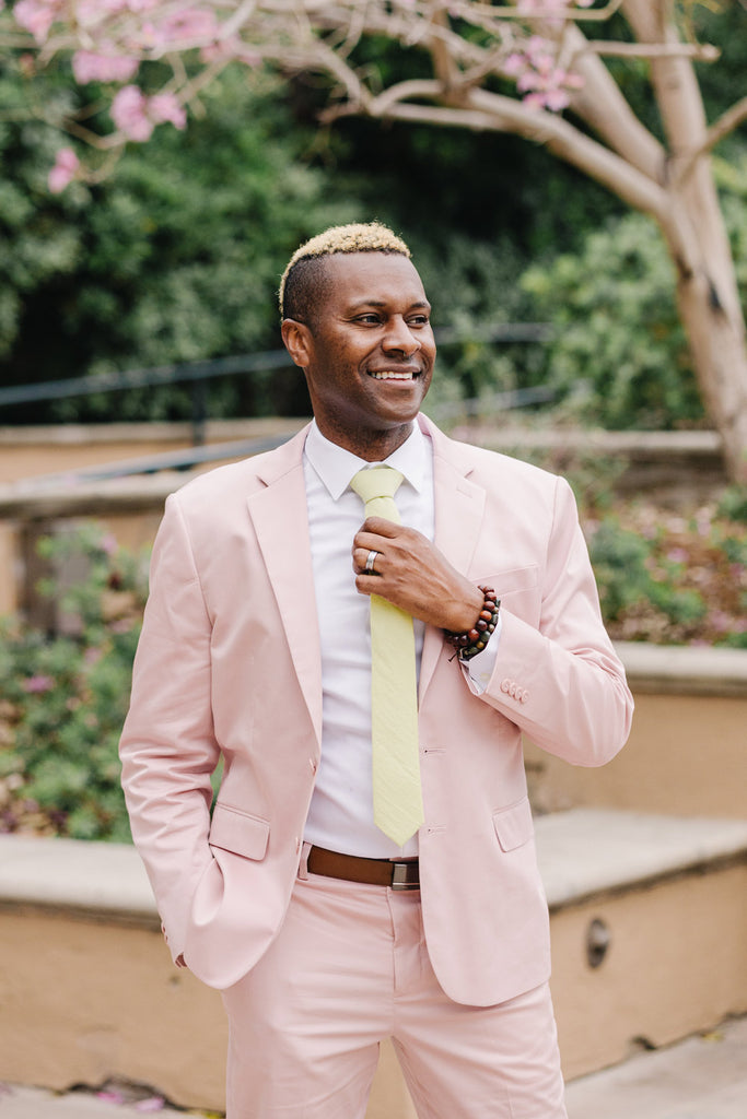 Pale Lime tie worn with a white shirt and light pink suit.