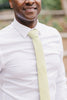 Pale Lime tie worn with a white shirt.