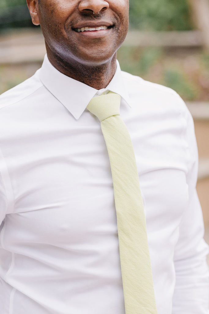Pale Lime tie worn with a white shirt.